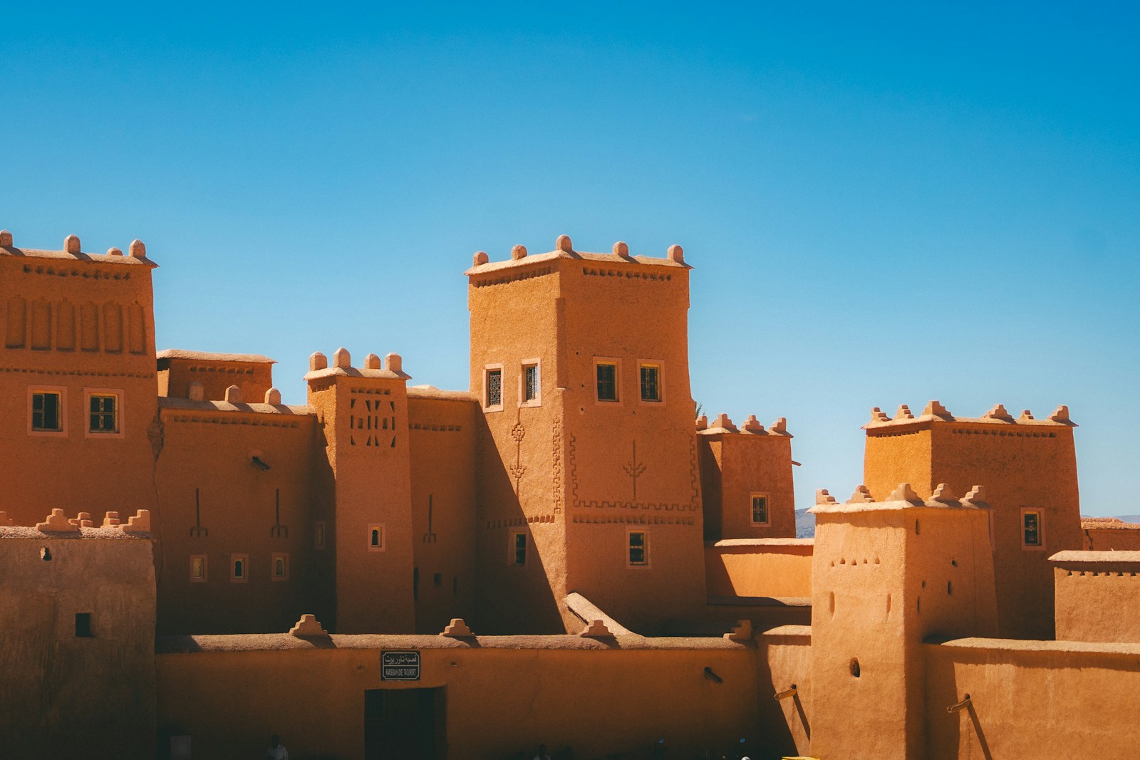 Ancient earthen fortress under a clear blue sky